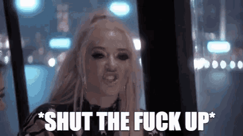 a woman with blonde hair is making a funny face and says `` shut the fuck up '' .