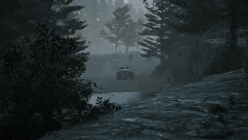 a monster truck with spikes on it is driving on a dirt road