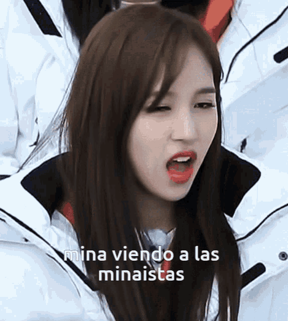 a close up of a woman 's face with the words mina viendo a las minaistas written on the bottom