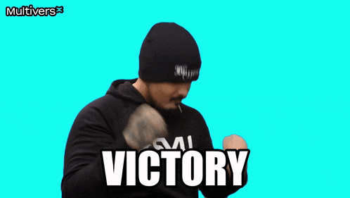 a man wearing a black beanie and a black hoodie with the word victory written on it