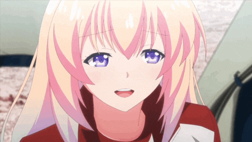 a girl with blonde hair and blue eyes is smiling with her mouth open