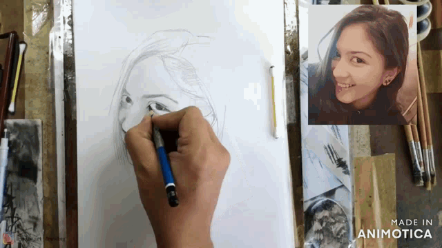 a person is drawing a woman 's face on a piece of paper made in animatica