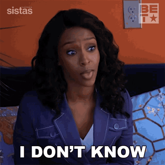a woman is sitting on a couch and saying i don 't know