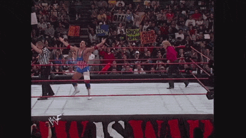 a wrestling ring with a sign that says ' wrestling ' on it