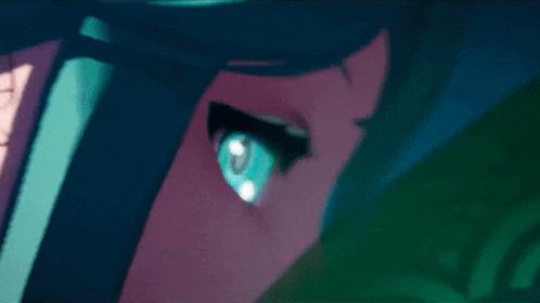 a close up of a person 's eye with a blue pupil