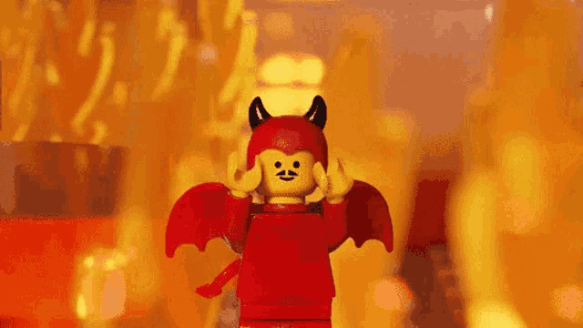 a lego figure dressed as a devil with a mustache and horns