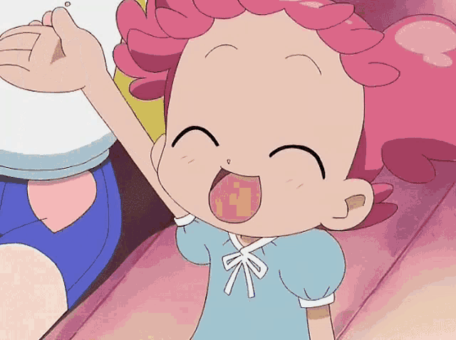a cartoon girl with pink hair and a blue shirt is smiling