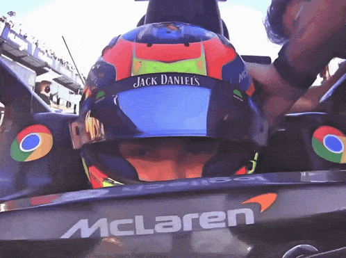 a man wearing a helmet that says jack daniels on it
