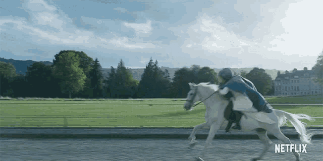 a man riding a white horse with netflix written on the bottom right