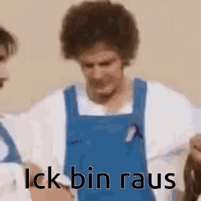 a man in a blue apron is standing next to another man in a white shirt and says `` lick bin rau '' .