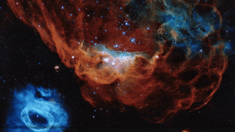 a spaceship is flying through a galaxy with a blue ring in the middle