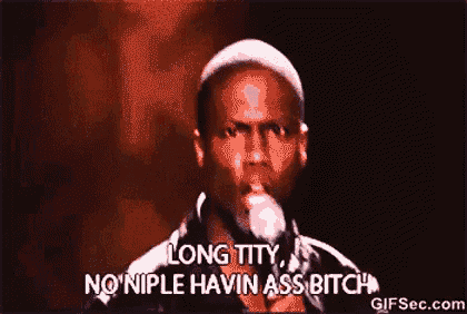 a man is talking into a microphone and saying long titty no nipple havin ass bitch