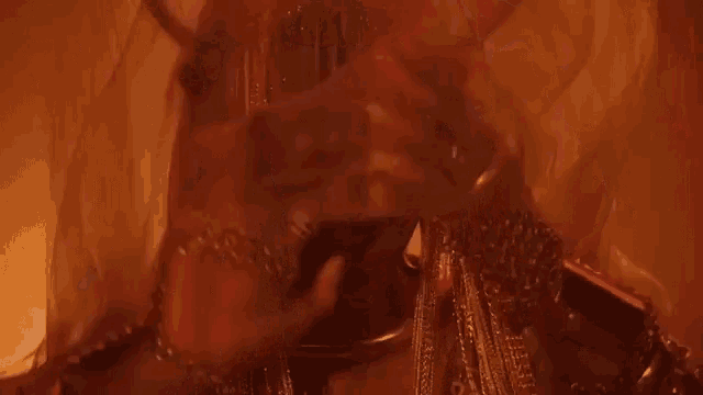 a close up of a person 's face covered in smoke in a dark room .