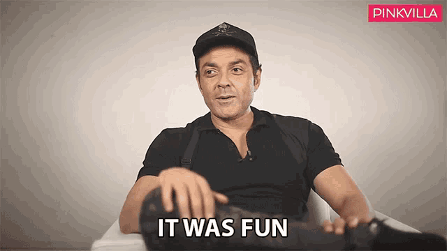 a man sitting in a chair with the words " it was fun " on the bottom