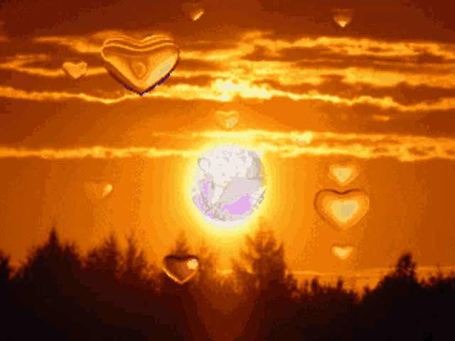 heart shaped balloons are floating in the air in front of a sunset