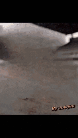 a close up of a dirty surface with the words by ulanjho on it