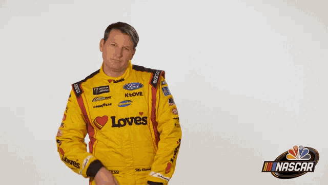 a man in a yellow racing suit that says loves on it