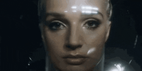 a close up of a woman 's face with a plastic wrap around it .