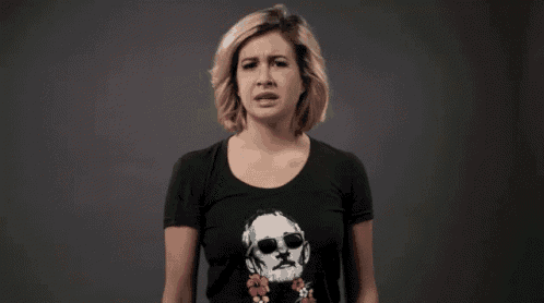 a woman wearing a black t-shirt with a skull on it