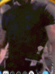 a close up of a person 's back with a black shirt on