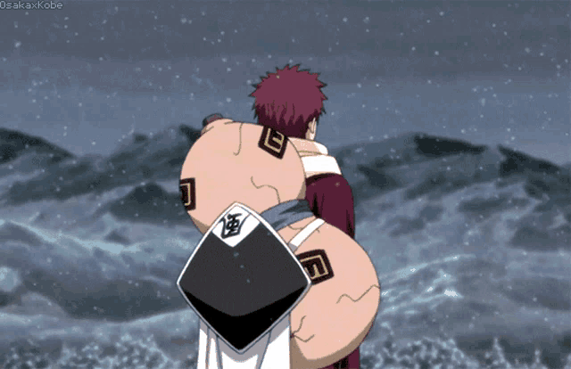 a gif of a man carrying a sand bag with the word osakaxkobe at the bottom