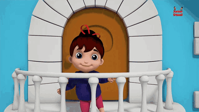 a little girl is standing on a balcony in front of a door that says annapurna on it