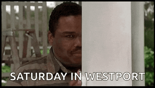 a man is peeking out from behind a porch post with the words `` saturday in westport '' .
