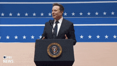 a man stands behind a podium that says president of the united states