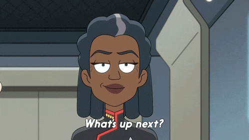 a cartoon character says " what 's up next " in white letters