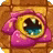 a pink monster with a yellow eye and teeth is sitting on a brick wall .