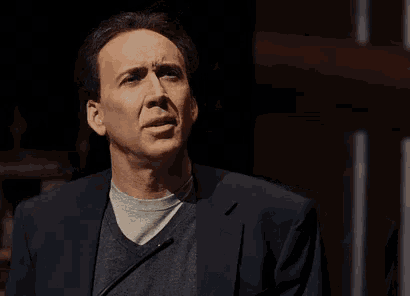 a man in a suit says " how absurd " in front of him