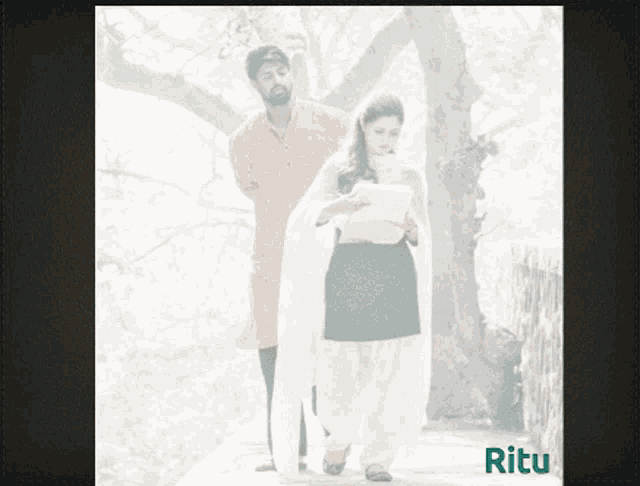 a picture of a man and a woman with the word ritu in green