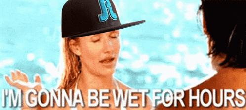 a woman wearing a hat with the letter j on it says i 'm gonna be wet for hours