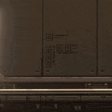 a pixel art drawing of a blue car with a person driving it