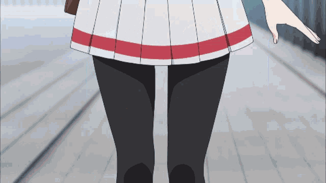 a girl in a white skirt with a red and white stripe on the waist