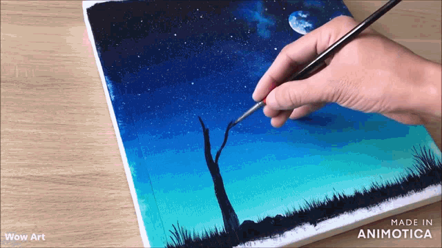 a person is painting a tree in the night sky with a brush