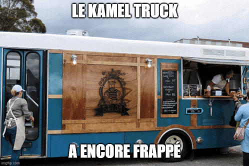 a blue and white food truck says le kamel truck a encore frappe