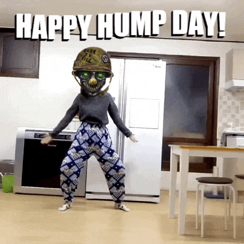 a woman is dancing in a kitchen with the words happy hump day on the bottom