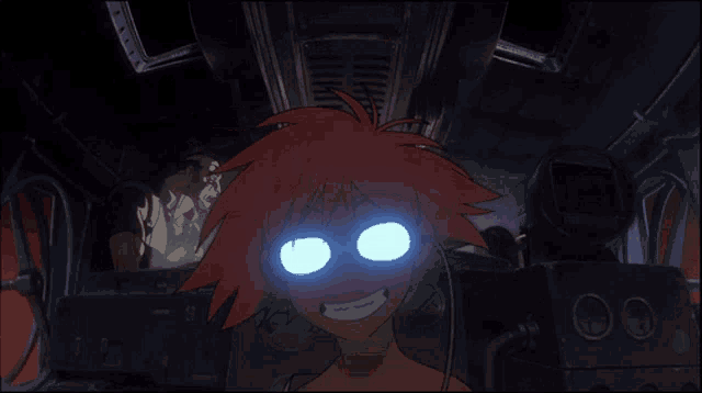 a cartoon character with glowing blue eyes is smiling in a dark room