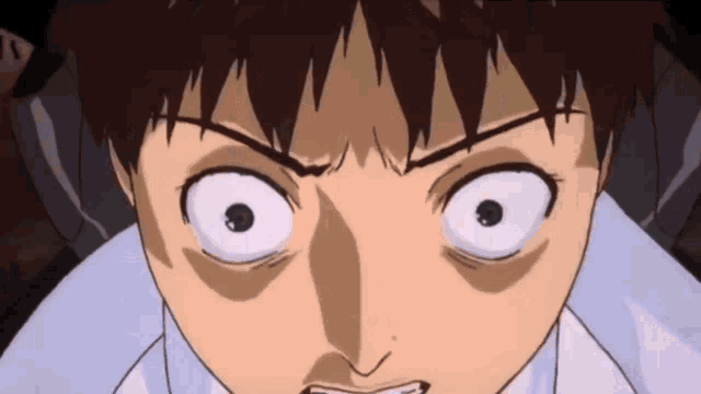 a close up of a person 's face with a very angry expression