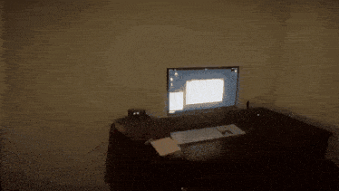 a dark room with a light on the wall and a shadow of a person on the floor .