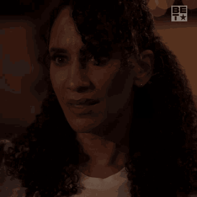 a woman says " no kiss goodnight " in a dark room