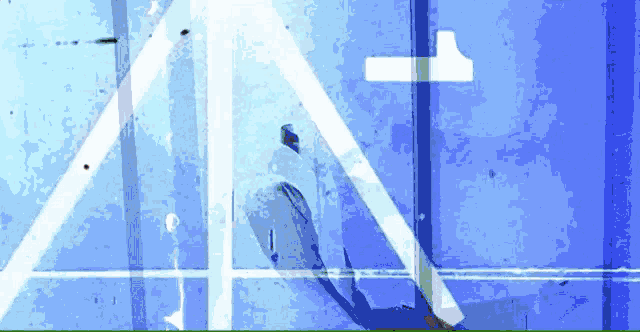 a blue background with white lines and the letter t