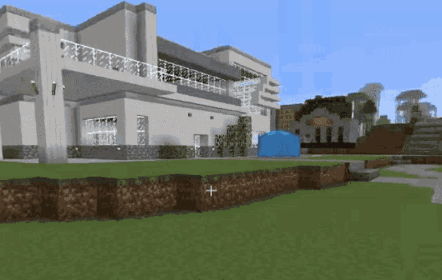 a blue tent is sitting in front of a large building