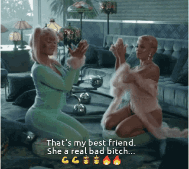 two women are kneeling down in a living room and one of them says that 's my best friend she a real bad bitch