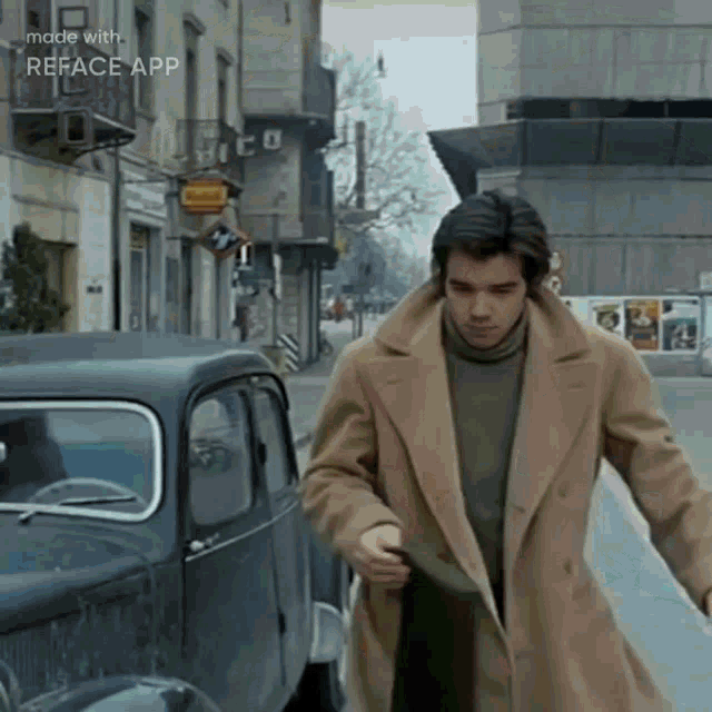 a man in a trench coat is walking down a street with a car in the background