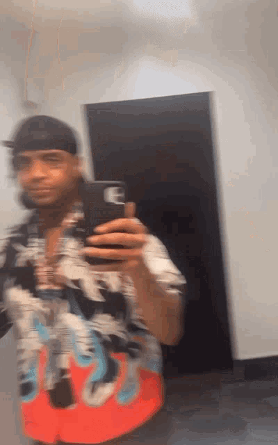 a blurry picture of a man taking a picture of himself