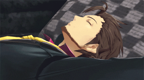 a man with brown hair and a beard is laying down