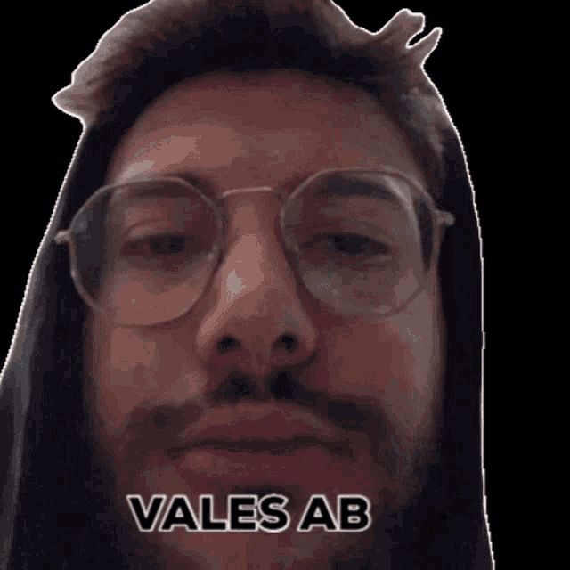 a close up of a man wearing glasses with the words vales ab written below him