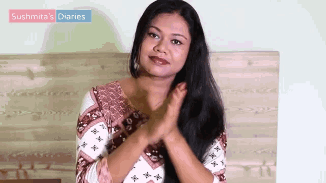 a woman clapping her hands with the words sushita 's diaries in the background